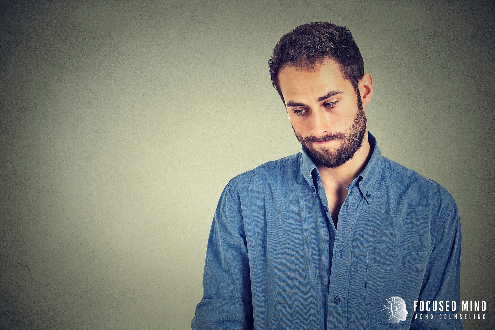 A man stares off towards the ground, representing the stress of facing rejection. A therapist in Columbus Ohio can help you overcome these symptoms at Focused Mind ADHD Counseling. Learn more about adult attention deficit hyperactivity disorder treatment in Ohio by searching "ADHD therapist for adults near me".