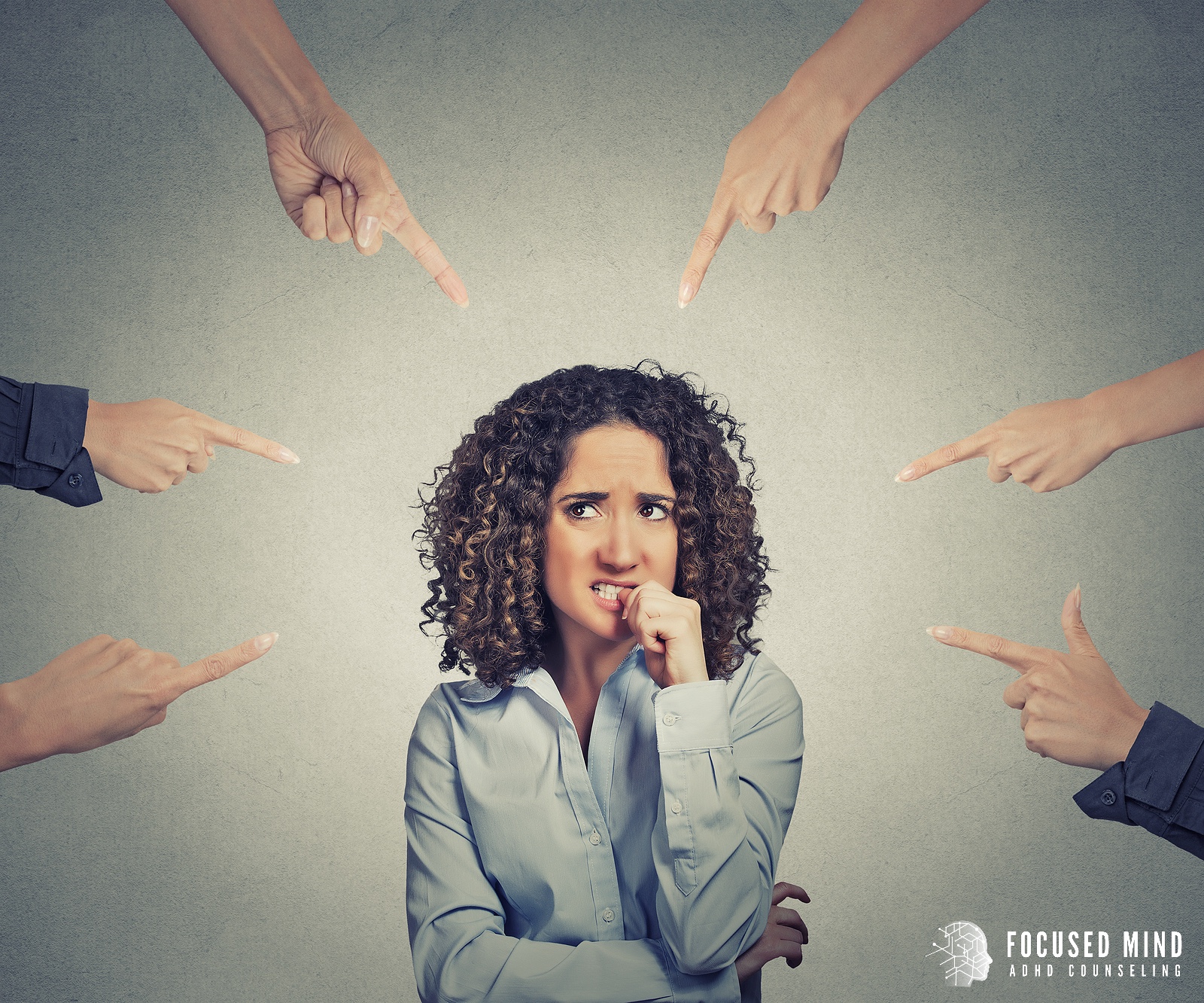 Hands point at a worried woman as she bites a fingernail nervously. Get support for ADHD and relationships by contacting an adult ADHD therapist in Ohio. They can help you address RSD and offer ADHD testing for adults in Columbus, OH today.
