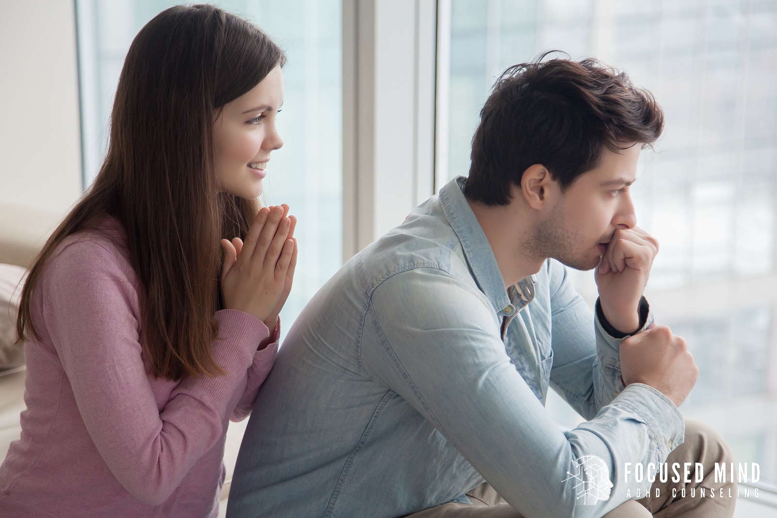 A woman pleads with her stressed partner while he looks away, showing the strain ADHD can place on relationships. Many couples find support through ADHD therapy in Columbus, OH with an adult ADHD therapist in Columbus, OH, guided by an adult ADHD specialist in Columbus, OH.