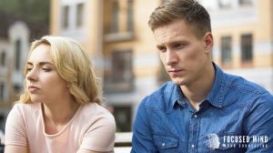 An upset couple sits in silence outdoors, symbolizing relationship struggles explored by a couples therapist in Columbus, OH, with support from ADHD couples therapist in Columbus, OH and resources for ADHD in adults Ohio.