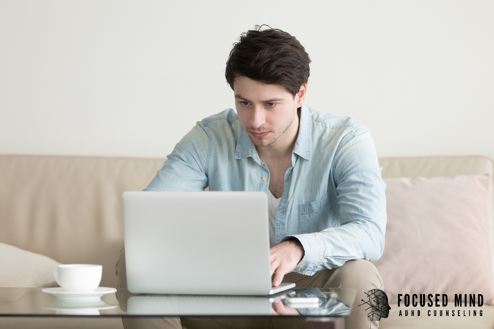 A focused man typing on a laptop keyboard. Exploring whether an ADHD assessment can be done virtually? An online ADHD therapist in Cleveland, OH, can show you the steps toward clarity and understanding. 
