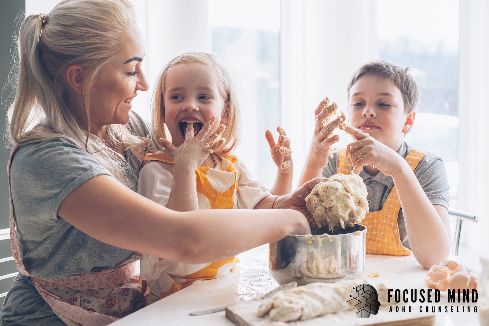 Picture of a happy mom baking with her two young children. Are you a parent with ADHD and looking for extra support? An online ADHD therapist in Cincinnati, OH, can help you work through your thoughts while preventing parenting burnout.