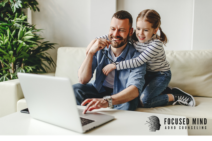 Photo of a little girl smiling while hugging her dad. Are you wondering about the challenges of parenting with adult ADHD? Online counseling and ADHD testing in Cincinnati, OH, can help you find answers and direction.