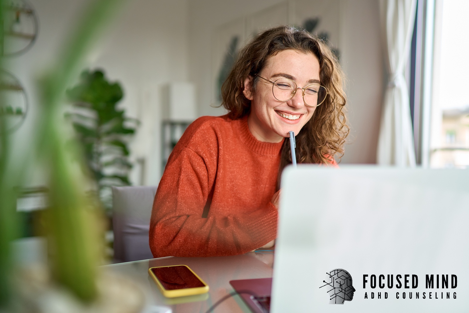 A happy woman looking at her laptop screen. Are you wondering what steps you need to take to get diagnosed with ADHD virtually? An online ADHD therapist in Cincinnati, OH, can help identify symptoms and provide guidance.