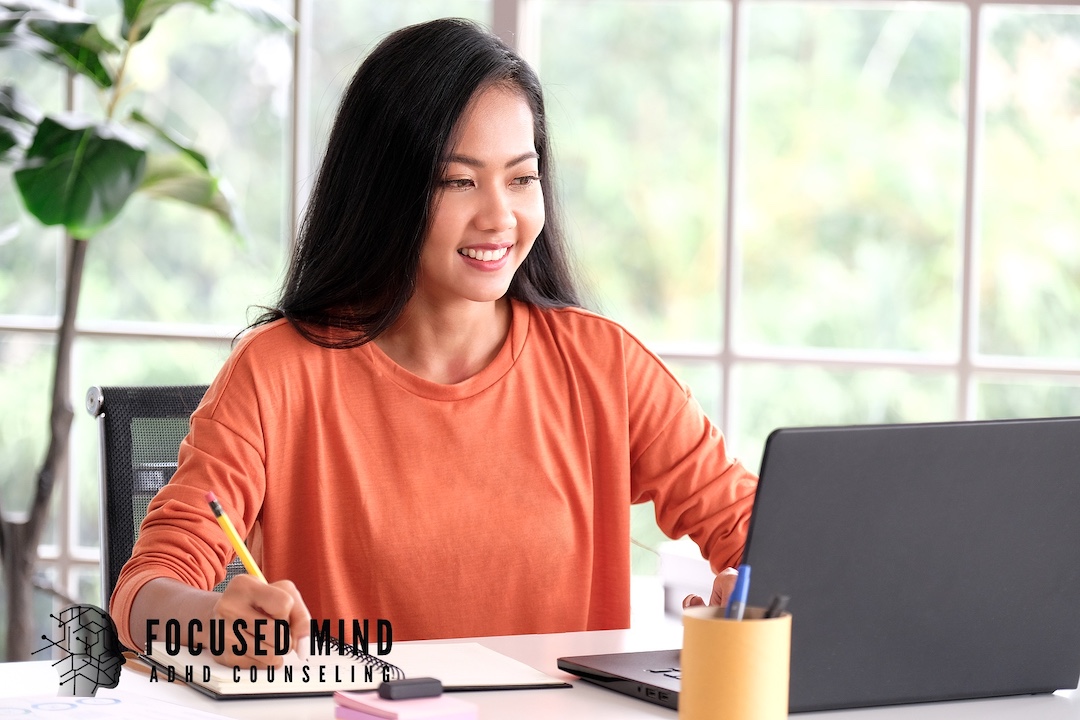 A woman takes notes while looking at a laptop screen. Are you considering an ADHD assessment but aren’t sure where to go? An online ADHD therapist in Cleveland, OH, can help you every step of the way. 