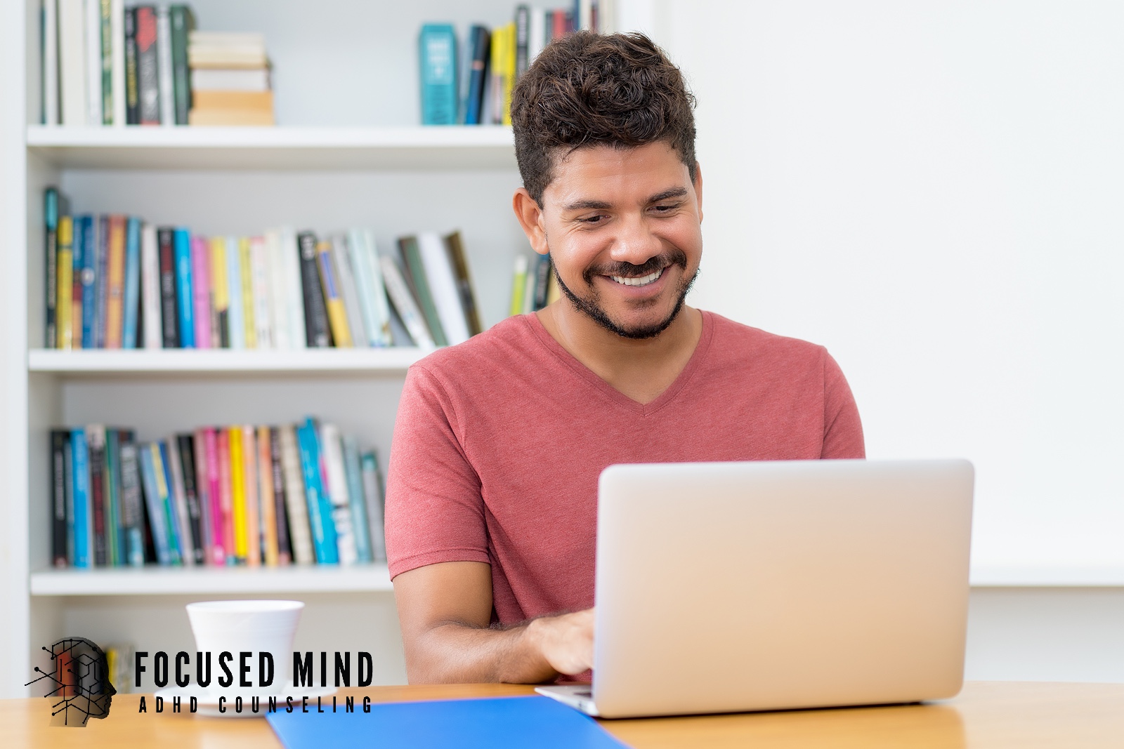 A man smiles while typing on a laptop. Are you wondering whether an ADHD diagnosis can be given virtually? Online ADHD testing in Cleveland, OH, provides insight and direction from the convenience of your home.
