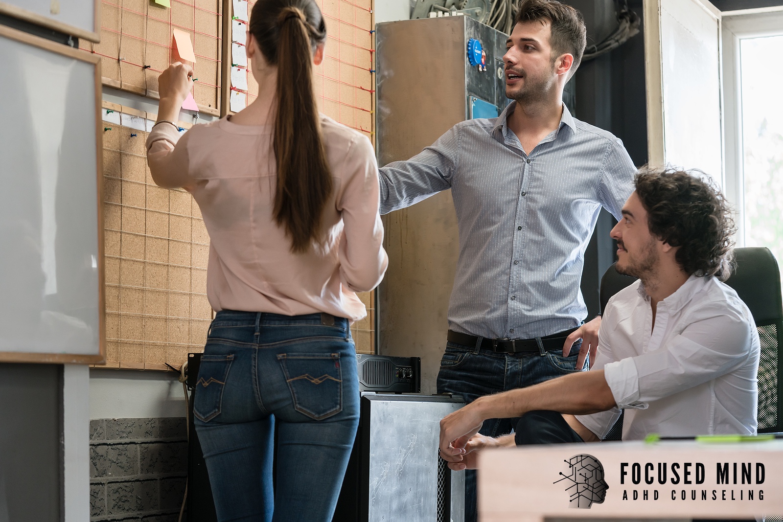 Three work colleagues organize colorful sticky notes on a corkboard. Time blindness can make planning and staying organized at work feel nearly impossible with ADHD. An ADHD specialist in Cleveland, OH can help you build effective systems and strategies.