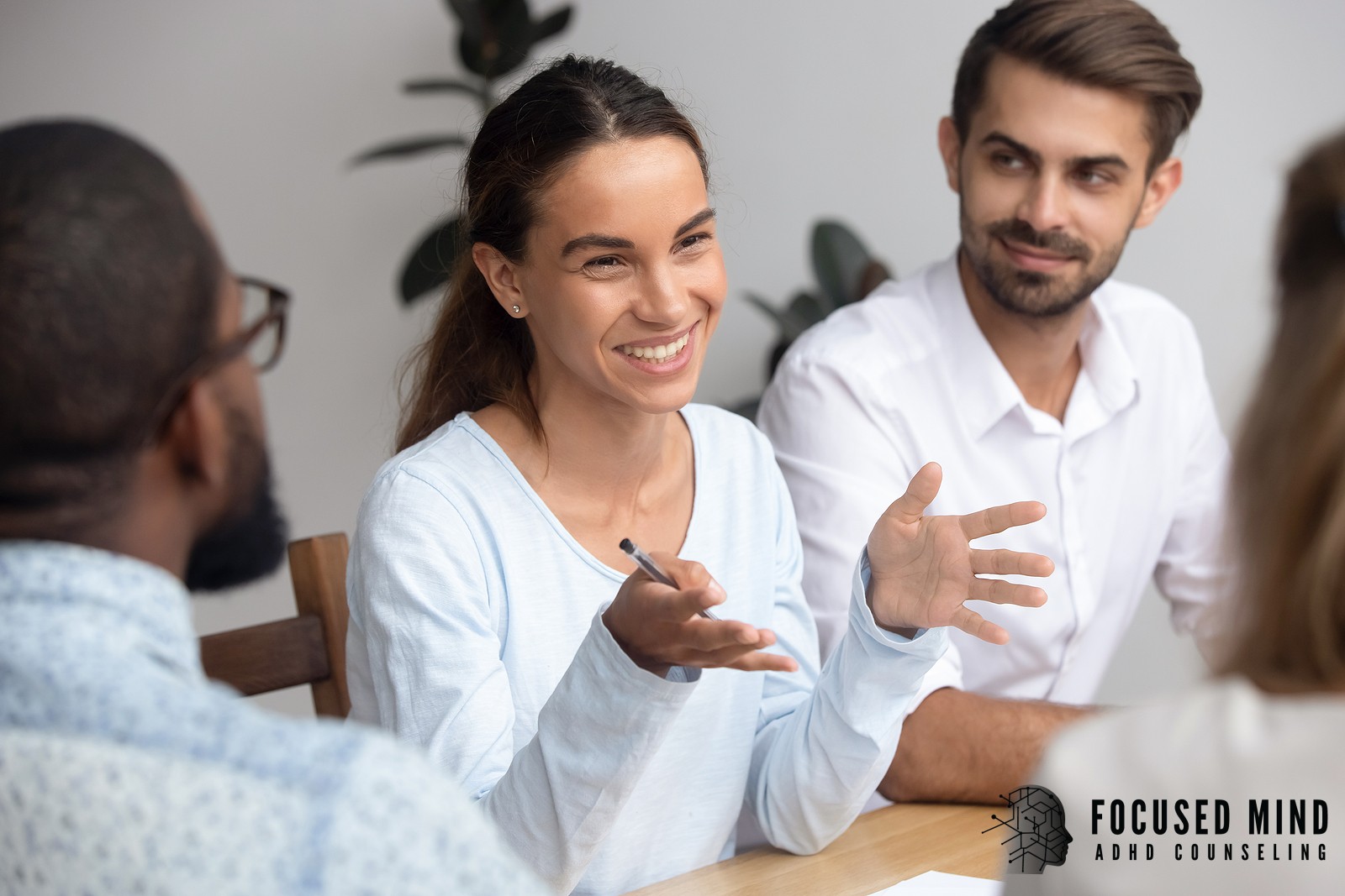 A woman speaks with colleagues around a meeting table. Motivation improves when people with ADHD find the right strategies and support systems that work for them. An ADHD specialist in Cincinnati, OH can help you discover what works.