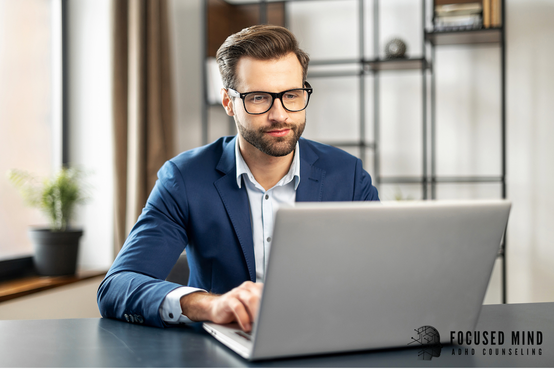 A man looking at a laptop screen. Does your life show signs of adult ADHD? Consider professional ADHD testing in Cleveland, OH, to get the answers you’ve been looking for and the treatment you deserve.