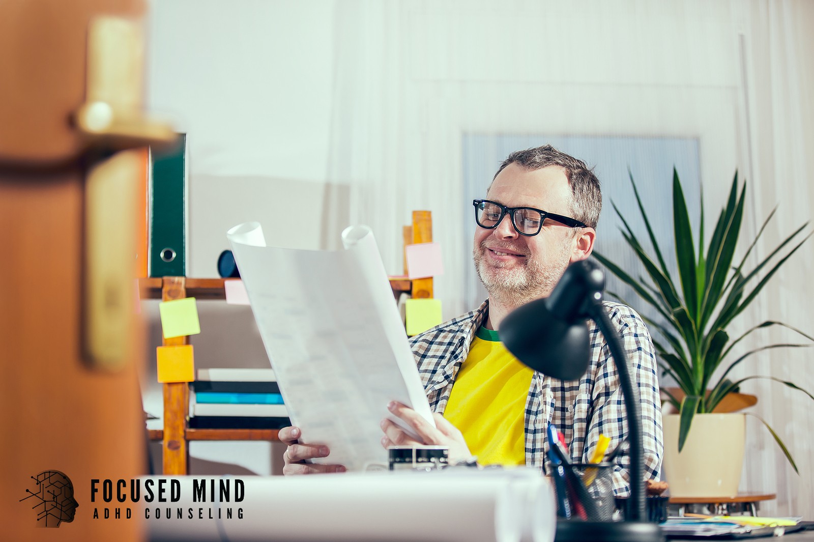 A focused man reviews a large document. What could your career look like if you finally understood how your ADHD brain works best? ADHD testing in Cincinnati, OH, gives you the insights to work smarter and achieve more.