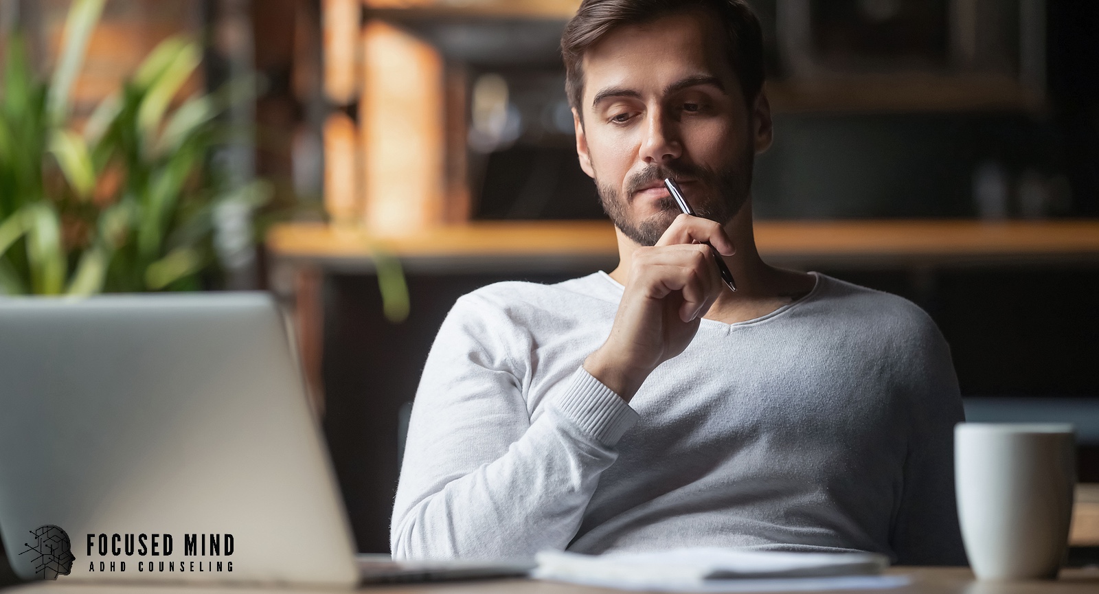 A man sits pensively at a laptop. Is rumination and constant overthinking making it impossible to focus, decide, or move forward with ADHD? An ADHD specialist in Cincinnati, OH can help you understand and manage your thought patterns.