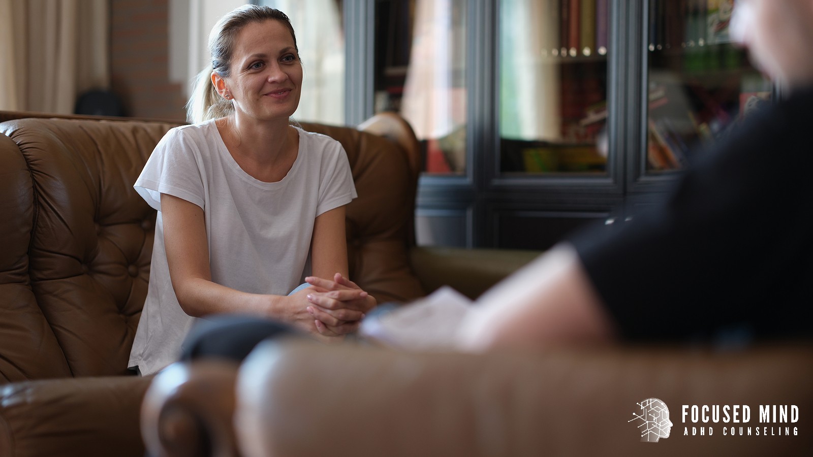 A woman sits attentively in a therapy session. Has uncertainty about your diagnosis left you feeling frustrated and without a clear path forward? ADHD testing in Cleveland, OH offers thorough evaluations so you can finally access the right support.