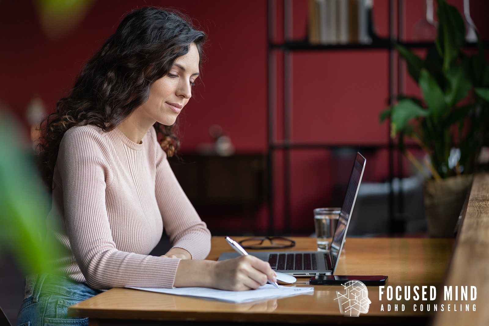 A woman writes notes beside an open laptop. Could a comprehensive evaluation finally give you the clarity and ADHD diagnosis you've been searching for? ADHD testing in Cleveland, OH provides the thorough assessment you need to move forward with confidence.