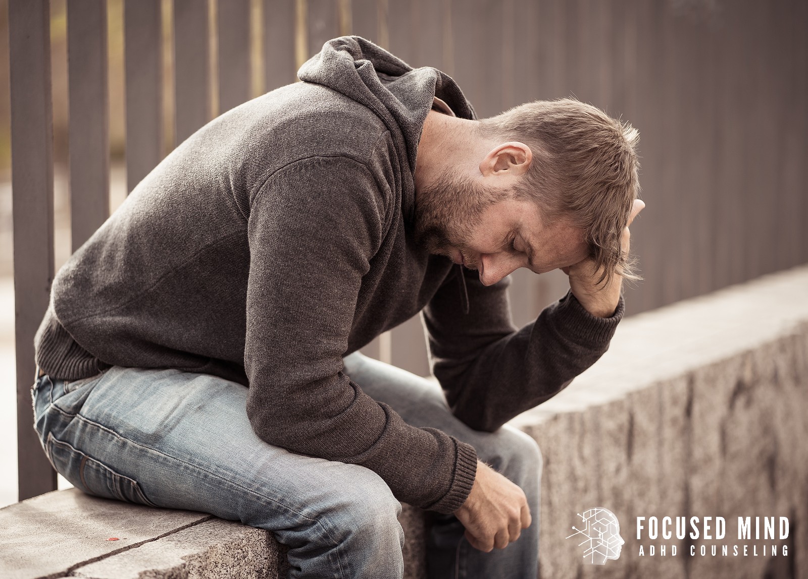 A man in a grey hoodie sits hunched on outdoor steps. Does emotional dysregulation leave you feeling ashamed and drained? ADHD testing in Cleveland, OH, can uncover what's really driving the intensity and open the door to targeted, compassionate support.